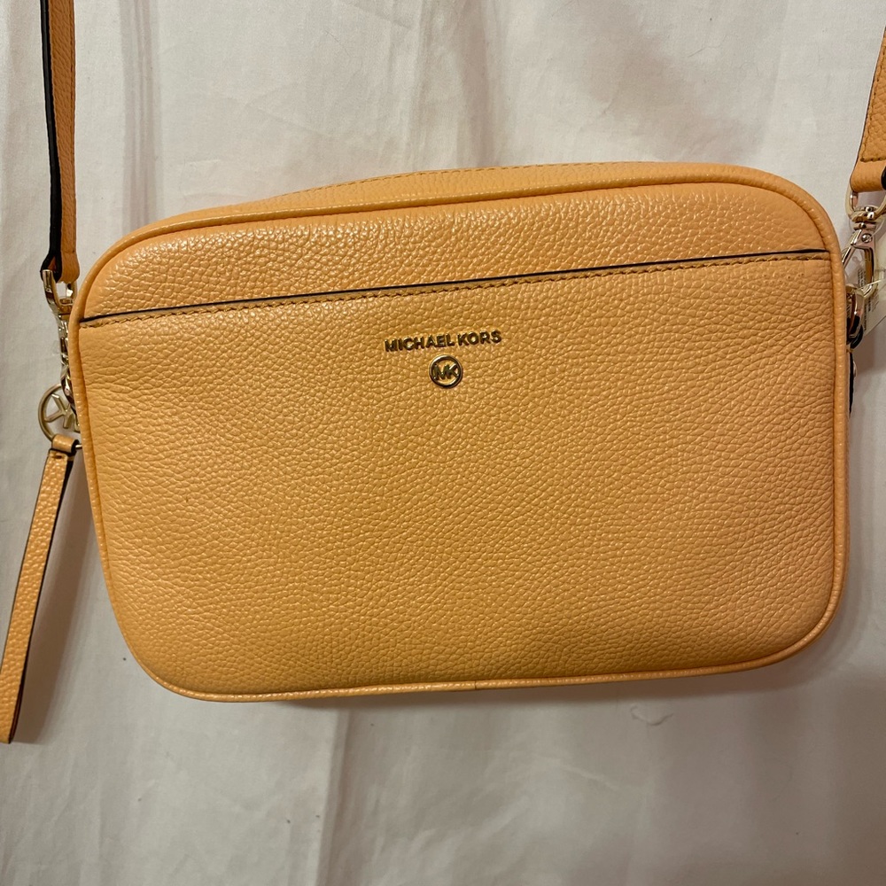 Michael by Michael Kors Jet Set Charm Camera Crossbody purse. color cantaloupe
